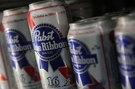 Multiple Pabst Blue Ribbon beer cans arranged together, showing red and blue label branding with number 16 visible