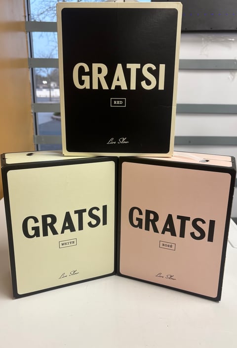 Three GRATSI wine boxes displayed - Red, White, and Rose varieties with black and colored packaging